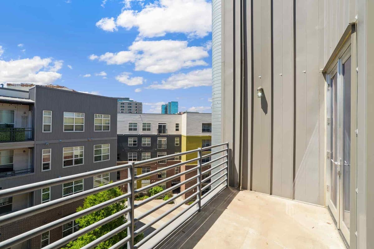 A sunlit balcony railing