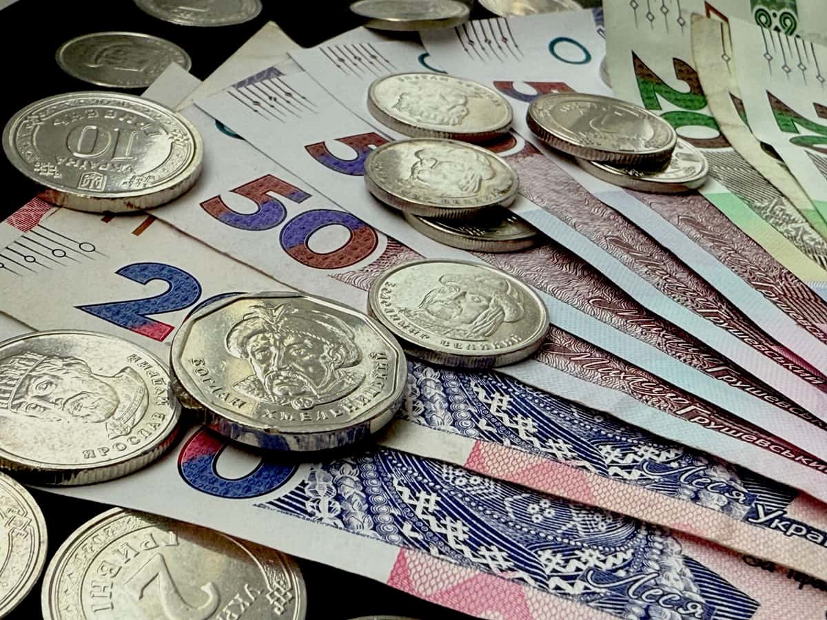 Assorted coins and banknotes on a surface