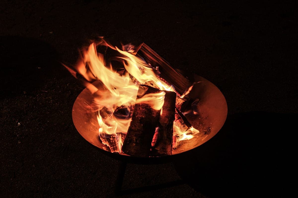 Glowing logs and embers in an open fire