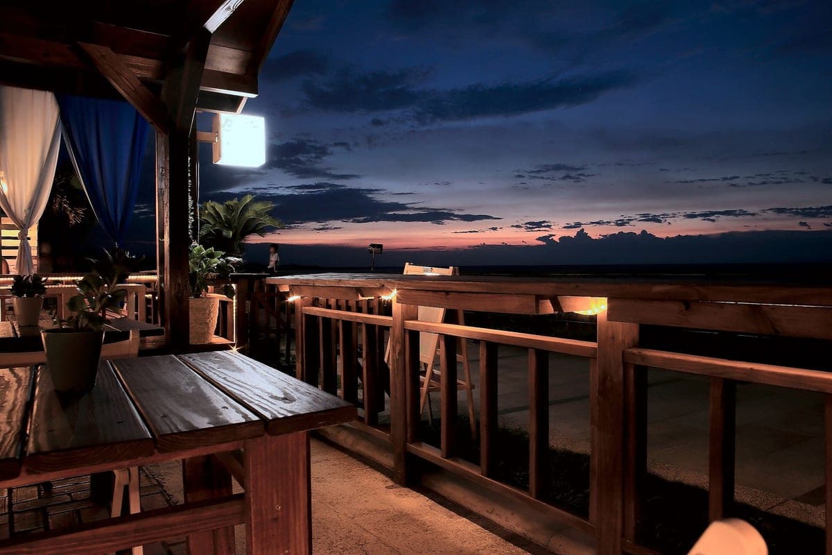 Outdoor tables and chairs at dusk