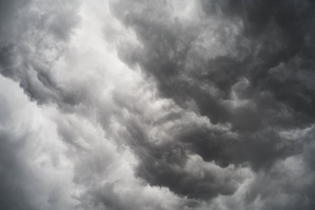 Smoke drifting against a gray sky